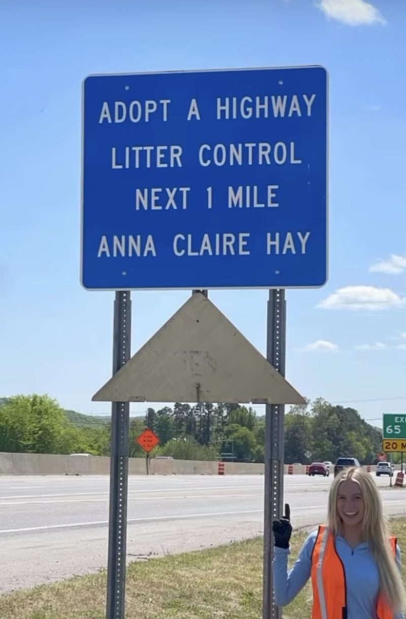 Anna Claire Hay beside her Adopt a Highway litter control sign
